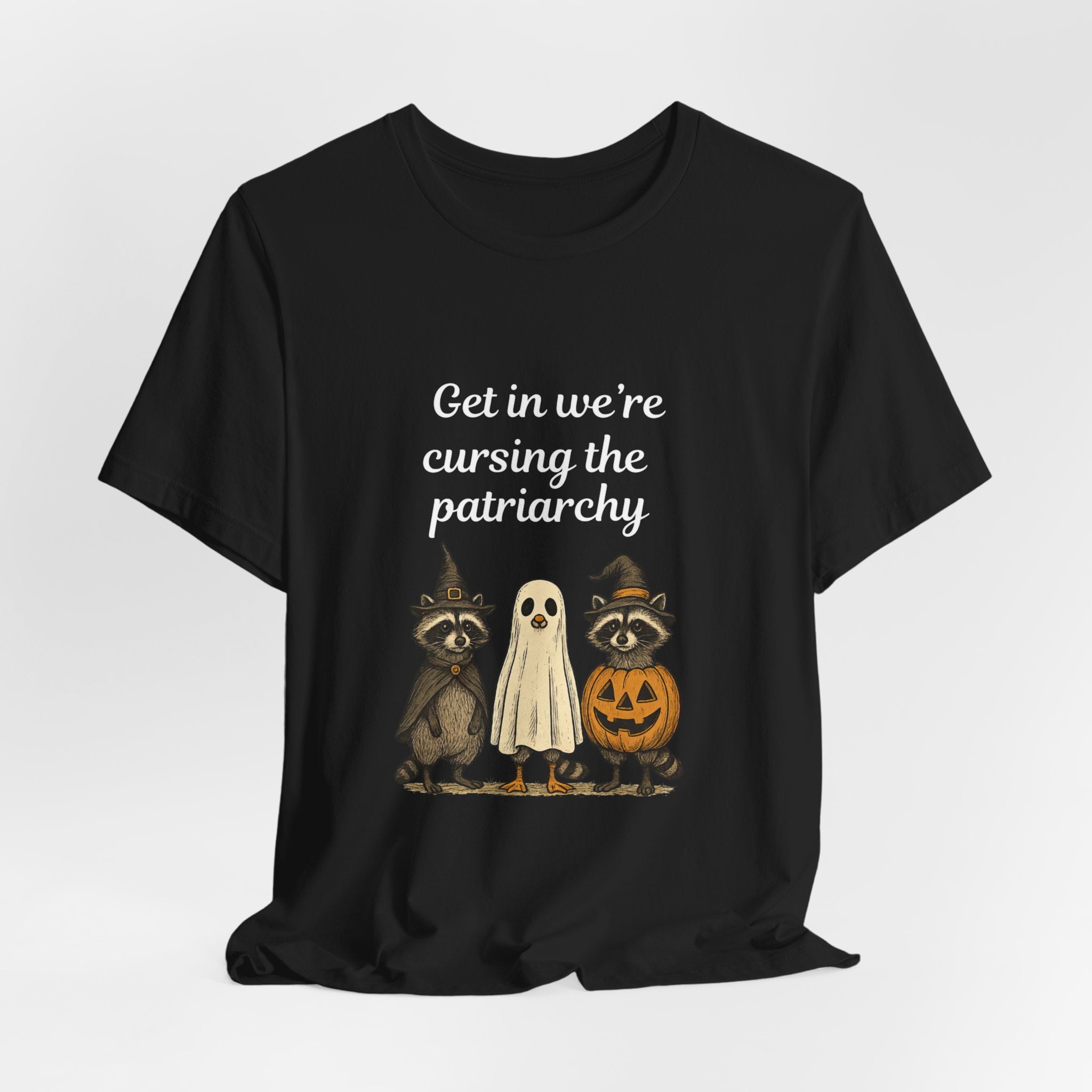 Get In We’re Cursing the Patriarchy Tee — Halloween Witch Ghost Raccoon Graphic Shirt